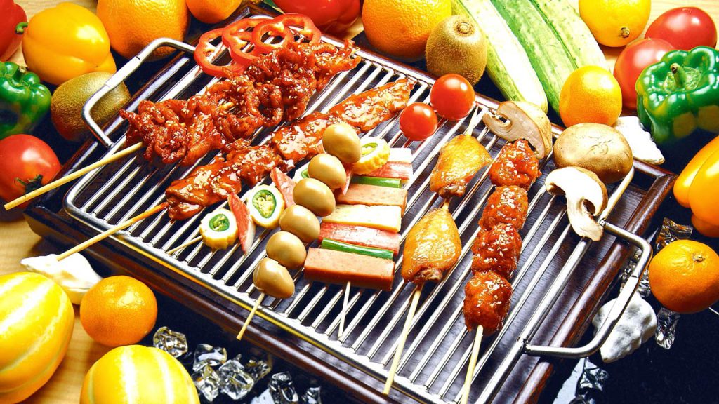 Barbecued food on grill