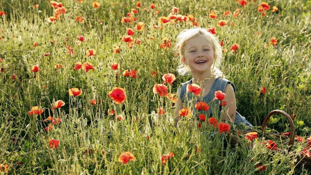 Girl in field of flowers
