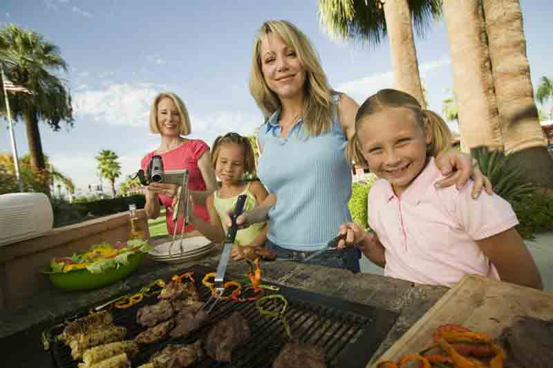 Family in front of barbecue