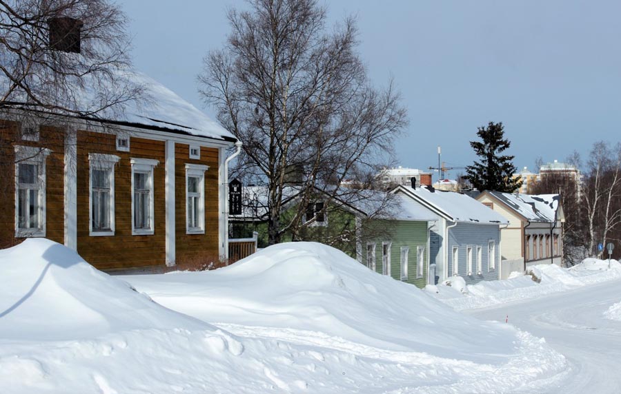 Houses with lots of snow in front of them