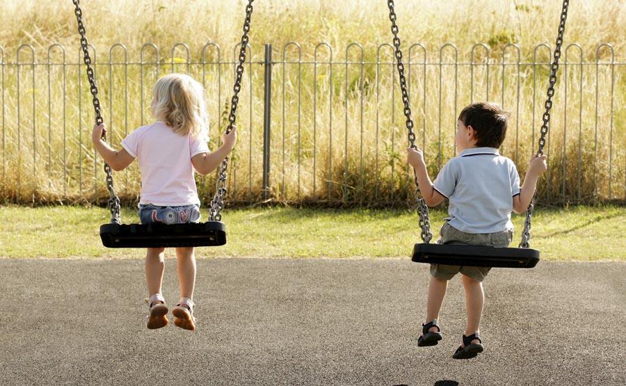 Two children on swings