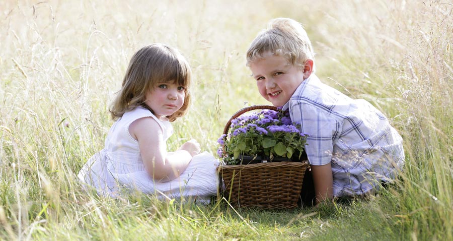 Two children with basket of lavender