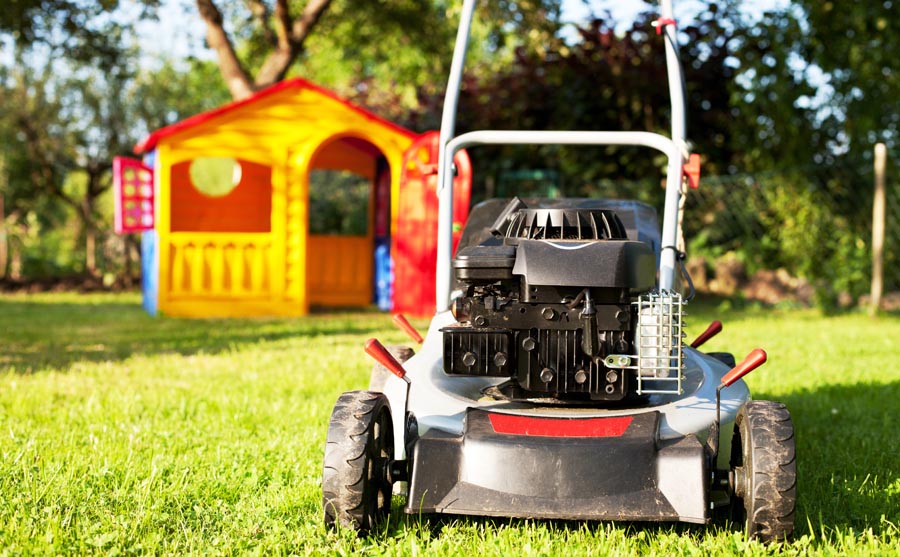 Lawn Mower viewed from behind with shed in background
