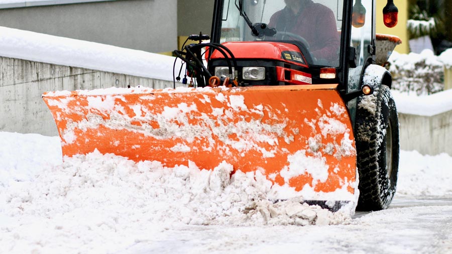 Snow plow being used