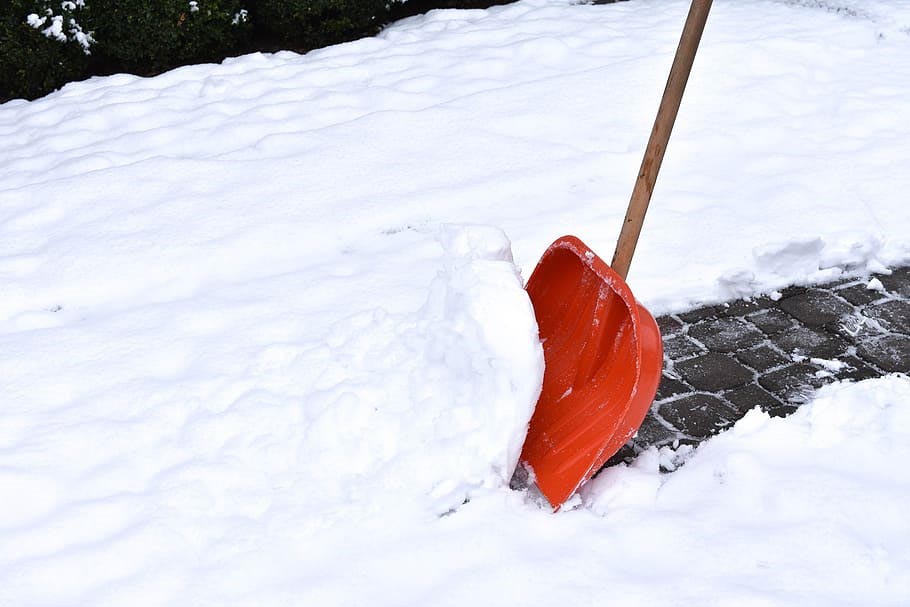 Snow shovel in snow