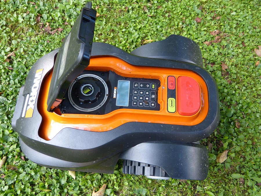 View of robotic lawn mower from above with programming buttons visible