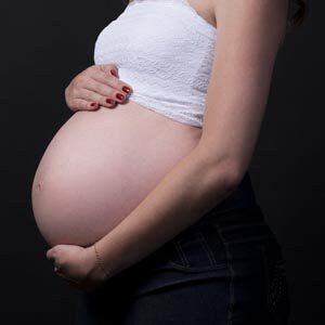 Pregnant lady holding belly