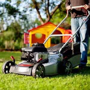 Man pushing lawn mower