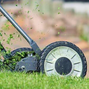 Mower cutting grass