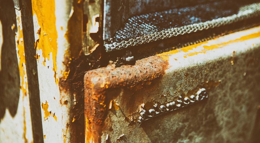 Close-up crop shop of an old rusty gas pump